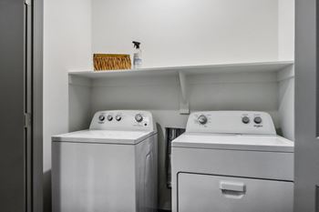 a small laundry room with two washes and a dryer at Stella, San Tan Valley, AZ 85143
